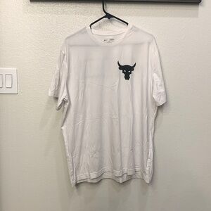 This is a men’s under armor, extra large, the rock T-shirt